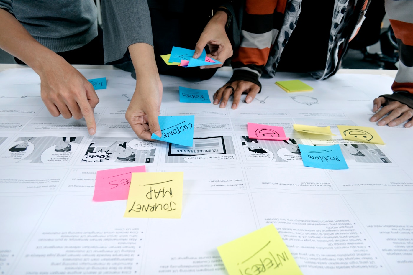 Team using sticky notes during a workshop facilitation session